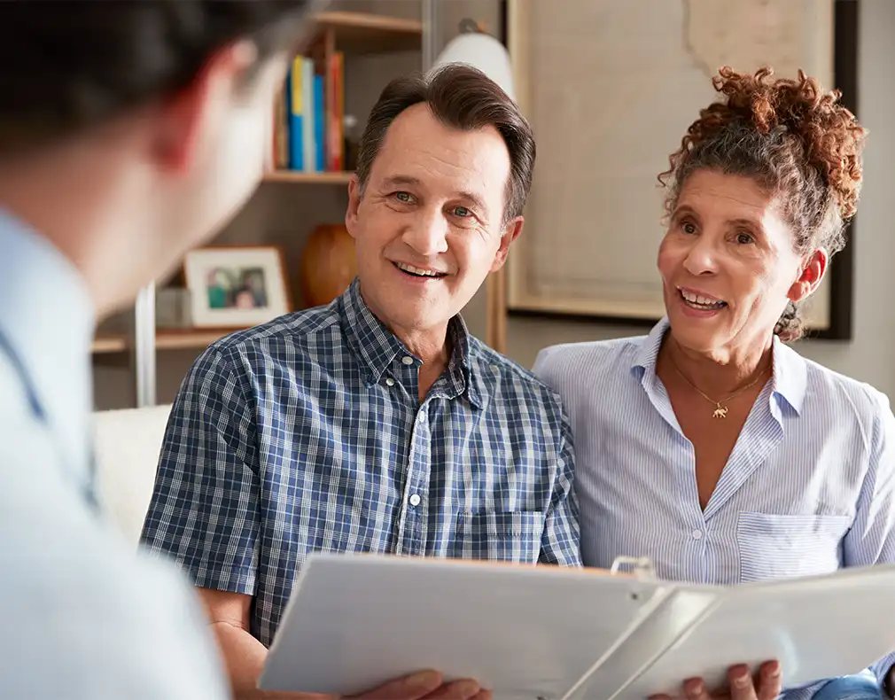 financial advisor meeting with couple to discuss keys to a successful retirement