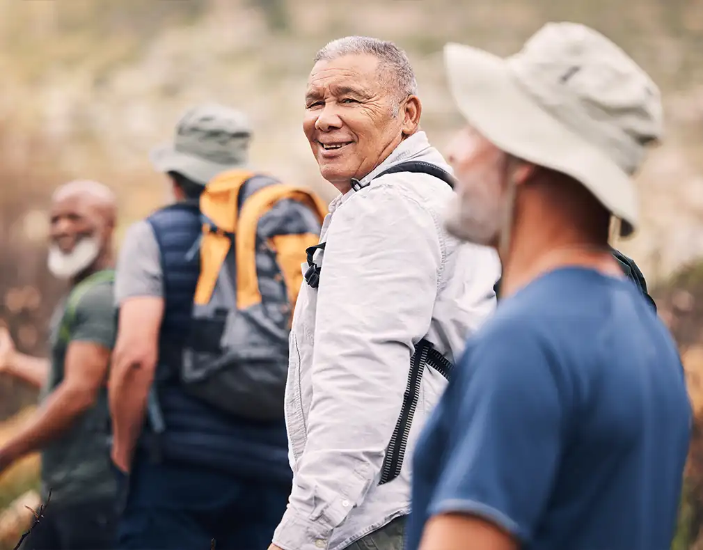 group of senior friends hiking together reasonable rate of return in retirement