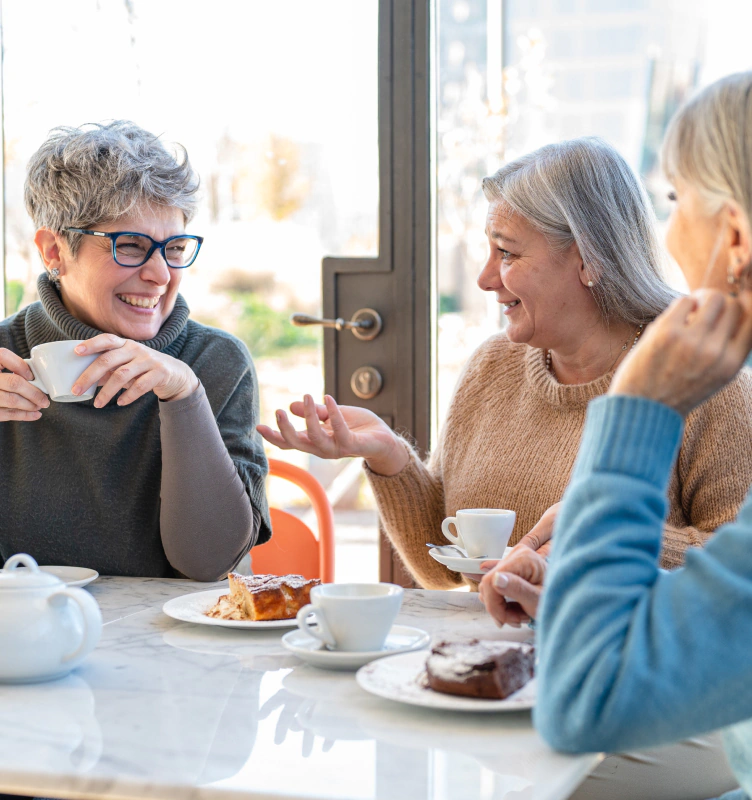 group of women having coffee and discussing annuity income